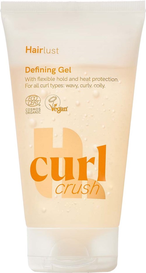 Witte tube haargelei genaamd Curl Crush met oranje en beige tekst en certificeringen voor biologisch en veganistisch.