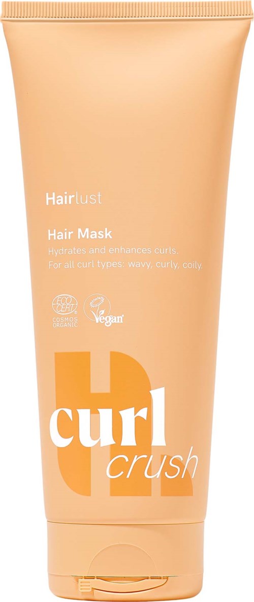Perzikkleurige tube van Hair Lust Curl Crush haarmasker met klepdeksel en productinformatie in wit en oranje.