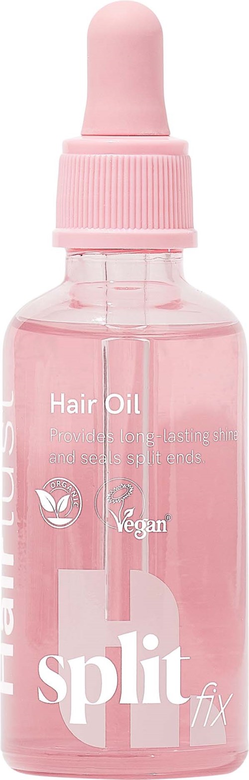 Pieni vaaleanpunainen hiusöljypullo tiputulpalla, merkintä Split Fix Hair Oil, vegaaninen ja sopii kaikille hiustyypeille.