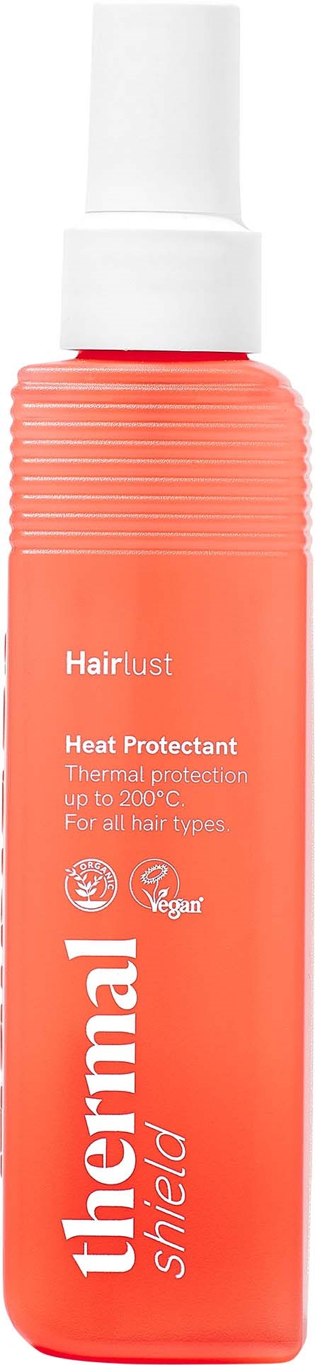A coral-colored bottle with a white spray cap, labeled Hairlust Thermal Shield Heat Protectant for all hair types.