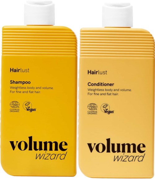 To gule flasker med Hairlust Volume Wizard sjampo og balsam med hvite lokker.