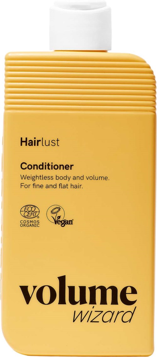 Gul flaske med Hairlust Volume Wizard balsam med svart tekst og logo.