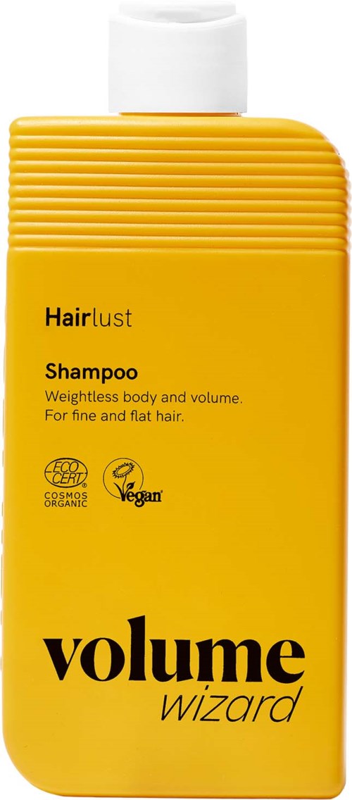 Gul sjampoflaske med svart tekst, merket Hairlust Volume Wizard, for fint hår, økologisk og vegansk.