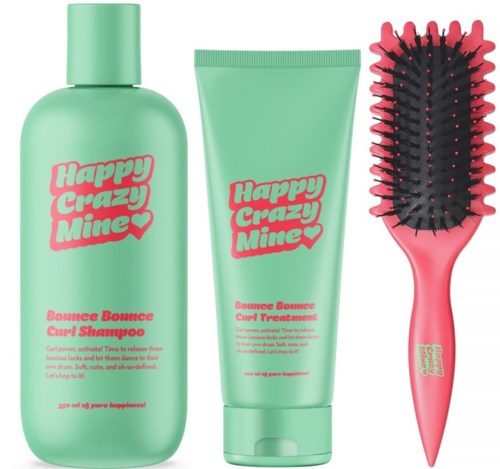 Kolme hiustenhoitotuotetta vihreissä pakkauksissa: shampoo, hoitoaine ja harja, jossa mustat ja pinkit harjat.