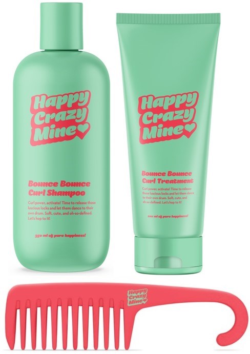 Vihreä shampoo ja vihreä hoitotuubi pinkillä tekstillä ja pinkki levekammainen kampa.