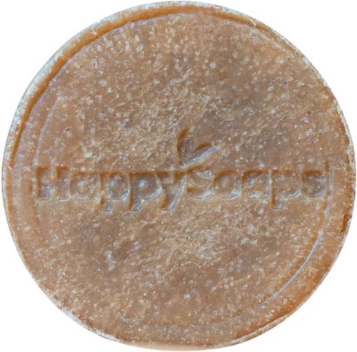 En rund, lys brun såpe med ordet 'Happy Soap' inngravert.
