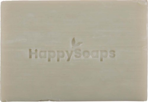 En hvid sæbeudskæring med teksten 'HappySoaps' og en lille bladlogo indgraveret.