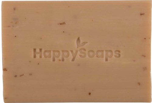 En beige sæbe med Happy Soaps-logo indgraveret.