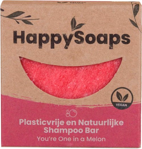 En pappeske med et smilende ansiktet, merket 'Happy Soaps', som promoterer veganske, plastfrie, naturlige sjampobar med sitronsmak.
