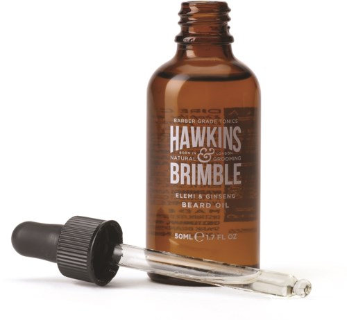 En brun flaska märkt Hawkins Brimble skäggolja, med en pipett bredvid.