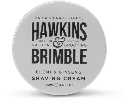 En rund behållare märkt Hawkins & Brimble rakkräm med element för grooming. Den nämner naturliga ingredienser som ginseng och Elemí.