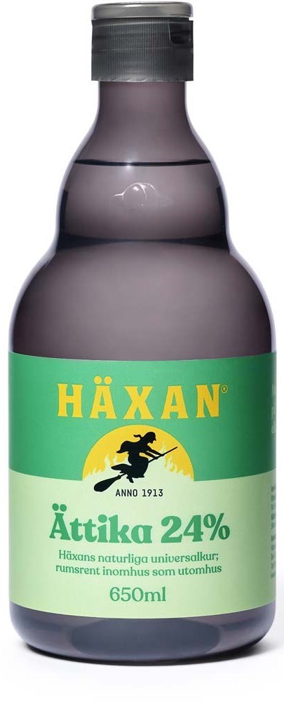 A dark glass bottle with green and yellow label, text in Swedish, 650ml volume, contains Häxan Ättika 24%.