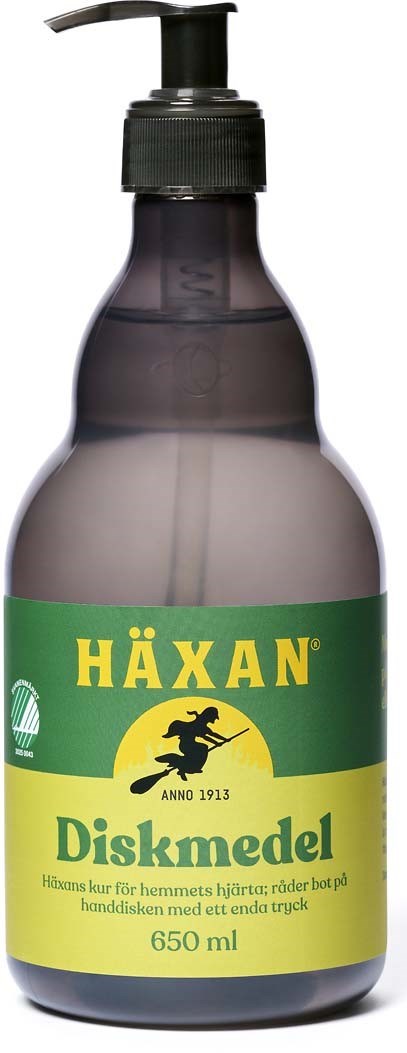 En grön och gul flaska märkt 'Häxan Diskmedel' med en svart pump, används för diskmaskin. Storlek: 650 ml.
