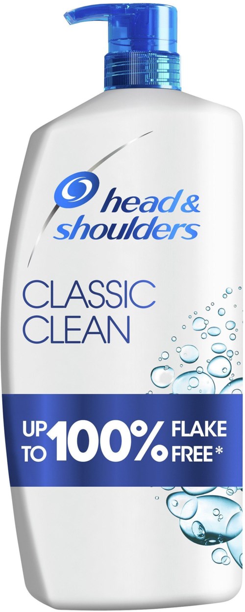 Eine weiße Flasche mit blauer Pumpe, beschriftet 'Head & Shoulders Classic Clean,' sagt, es entfernt Schuppen bis zu 100 %, mit Wasserblasen auf dem Label.
