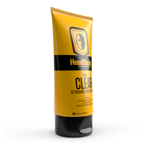 Gul tube av HeadBlade Head and Face Aftershave med svart lokk, logo og tekst.