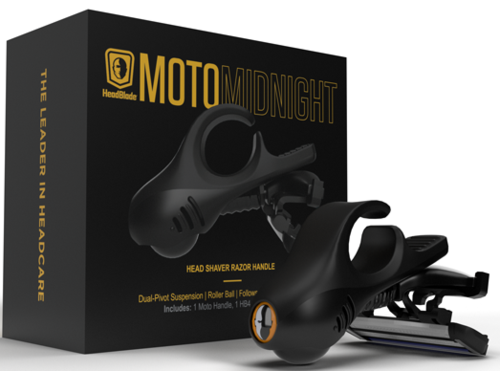 En æske viser en sort barbermaskine med håndtag, kaldet MOTOMIDNIGHT, med rollerball ophæng og sort håndtag.