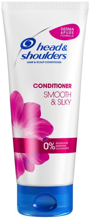 En hvit tube med Head & Shoulders balsam med rosa blommedesign, merket 'Smooth & Silky', og nevner 'derma & pure formula.'
