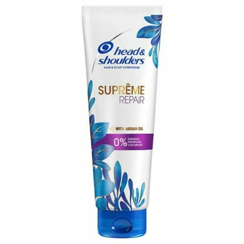 En vit tub med Head & Shoulders schampo med blå och lila design, som visar att det är för reparation och innehåller arganolja.