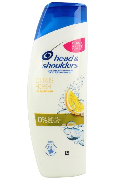En flaske Head & Shoulders sjampo, sitrus smak, blå og hvit design, påstår å forebygge flass, inneholder ikke parabener.