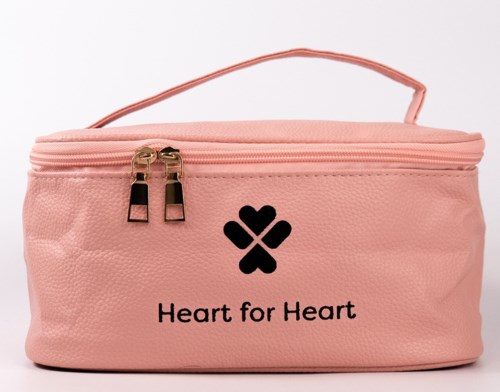 Pink bag with a heart-shaped logo and the text "Heart for Heart".