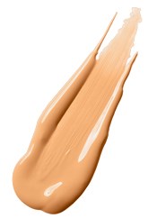 En klatt beige kremaktig substans på hvit bakgrunn, ser glatt og tykk ut.