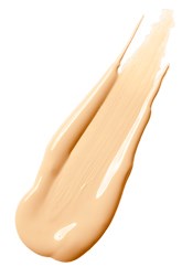 En beige skum eller krem som er påført over en overflate, med en jevn og kremaktig tekstur.