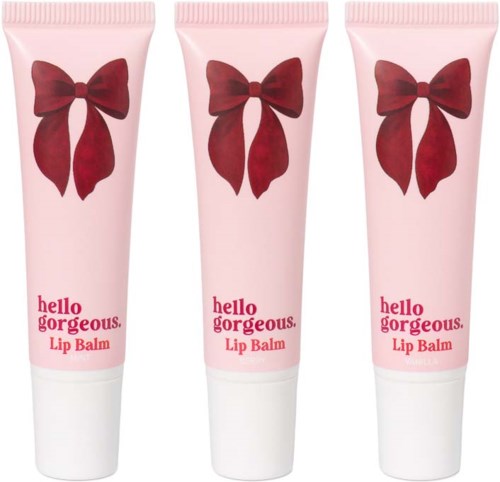 Three pink tubes of Hello Gorgeous Lip Balm with red bows on the packaging.