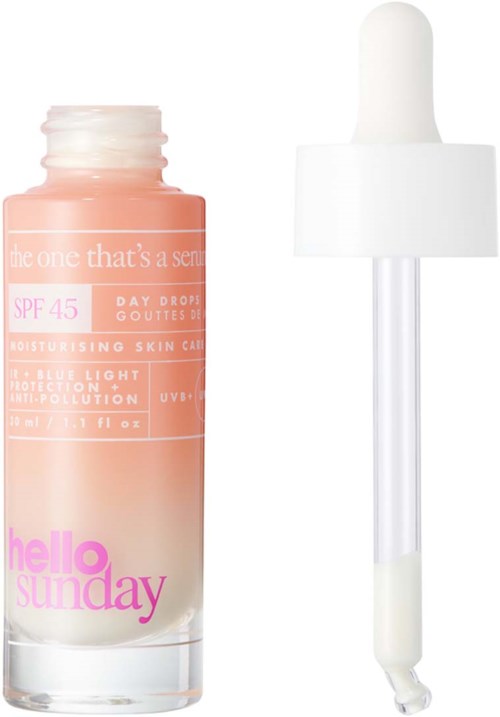 En lille flaske med pipette, mærket 'hello sunday,' bruges til hudpleje eller solcreme, med rosa og hvid design.