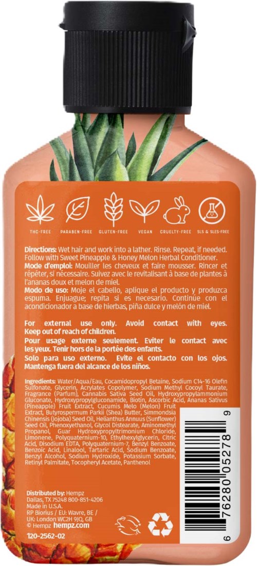 A bottle of sunblock with pineapple and aloe images, instructions, ingredients, and recycling symbols.