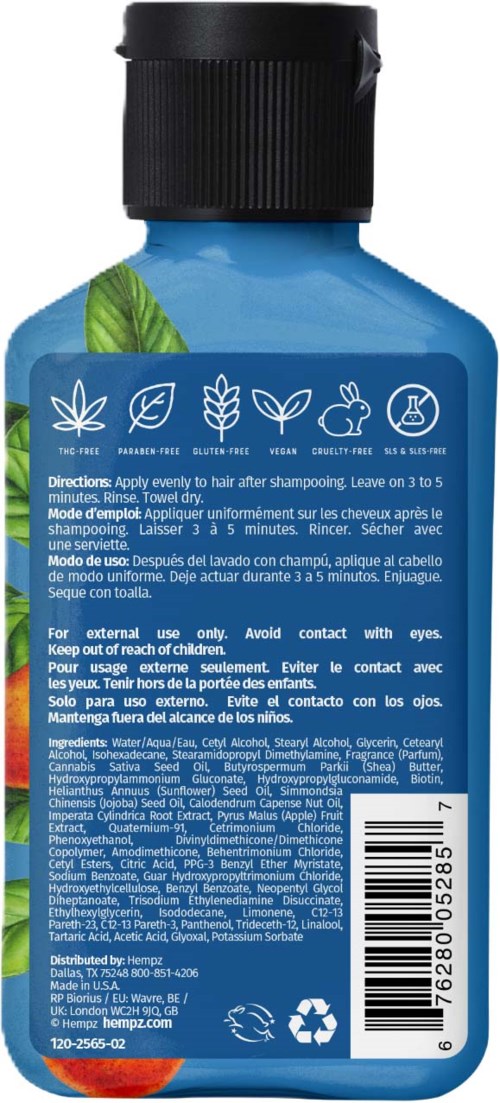 Sininen shampoopullo vihreillä lehdillä, sisältää yrttisen hiustenhoitotuotteen ulkoiseen käyttöön, ohjeet ja ainesosat.