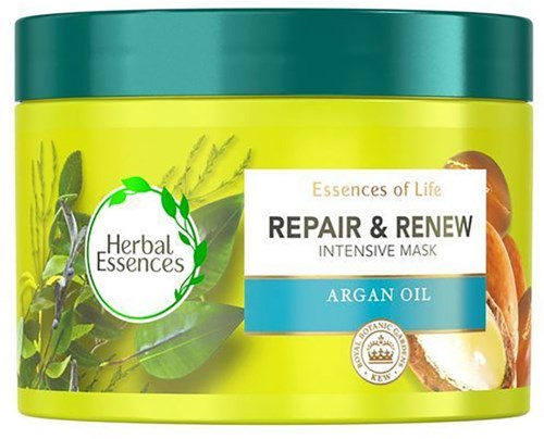 En ljusgrön behållare med örtmask för håret med arganolja för reparation och förnyelse.