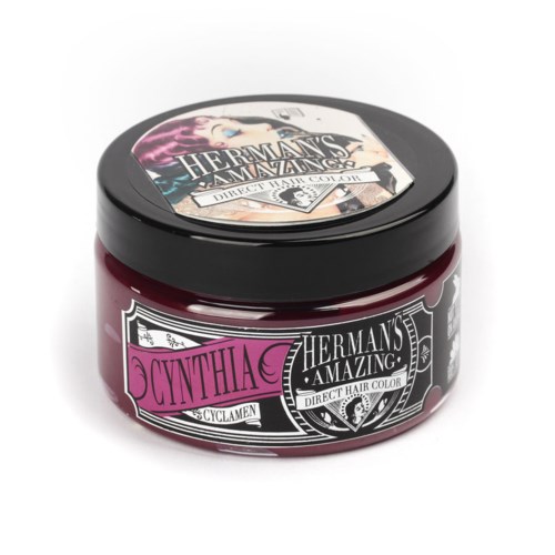 En liten burk hårfärg som heter Cynthia från märket Hermans' Amazing, med svart lock och rosa etikett.