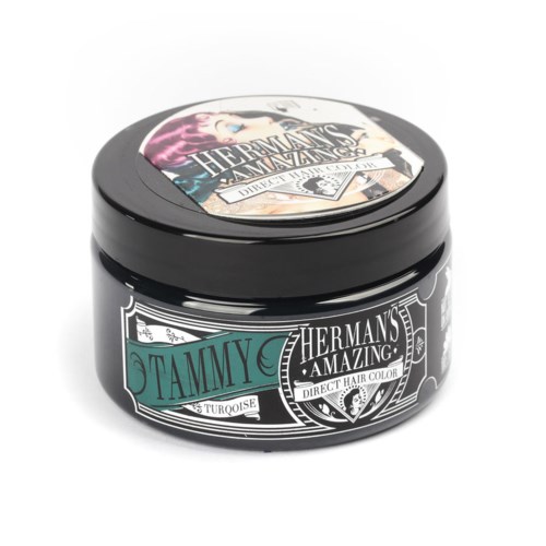 En svart burk med hårfärg märkt "Tammy" med turkosa detaljer, med text "Hermans Amazing" och "Direct Hair Color."