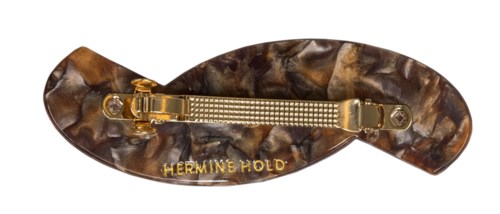En stor, oval hårklämma med marmormönster och guldkrok, märkt 'HERMINE HOLD' i guld.