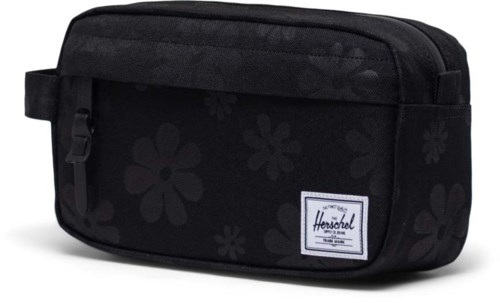 Black bag with flower patterns and a Herschel label, made for carrying small items or as a school case.