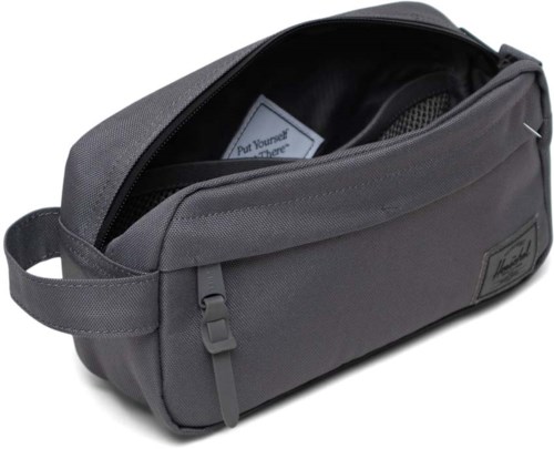 A gray bag with a zipper, handle, and a label, designed for carrying personal items. The bag is open, showing inside space.