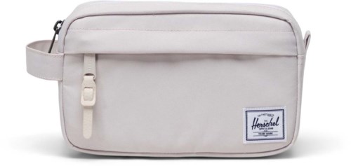 A light-colored bag with zipper pockets and a Herschel logo on front. It looks simple and practical.