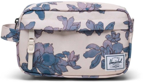 A small bag with blue and purple flower patterns on a light background, with a logo label on the front.