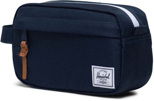 A navy blue Herschel bag with a small front pocket and a brown zipper pull, made of fabric.