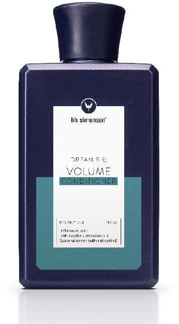 En mørk blå flaske med balsam med hvit etikett og svart lokk.