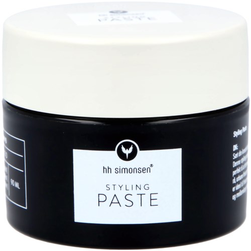 En svart burk med vit lock, märkt "hh simonsen STYLING PASTE" för hårstyling.