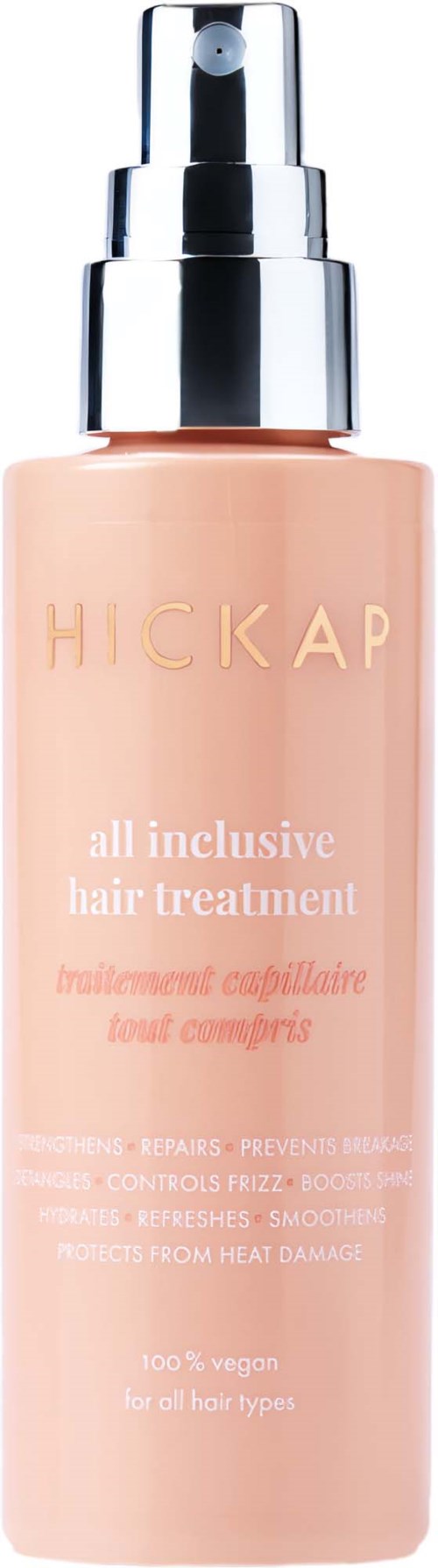 En peachfärgad flaska med hårbehandlingsspray och silverpump, märkt 'HICKAP all inclusive hair treatment.'