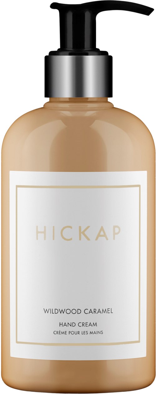 En lotionflaske merket Hickap Wildwood Caramel Hand Cream med pumpe.