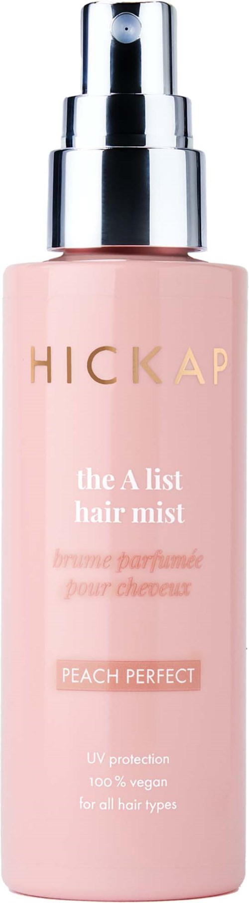 Ljusrosa flaska med en silver spraytoppen, märkt 'HICKAP the A list hair mist,' doft 'PEACH PERFECT,' för hårskydd.