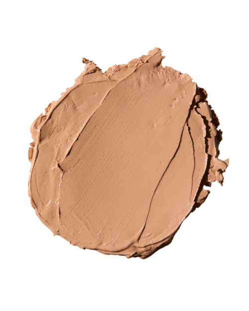Ett beige kosmetikkrämprov med synliga drag och en liten kurva, på en vit bakgrund.