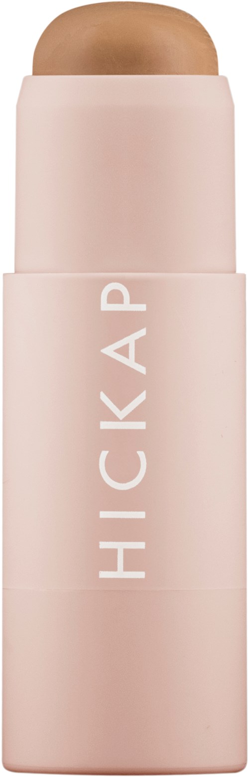 A light pink stick with the brand name 'HICKAP' on it, probably a cosmetic or skincare product.