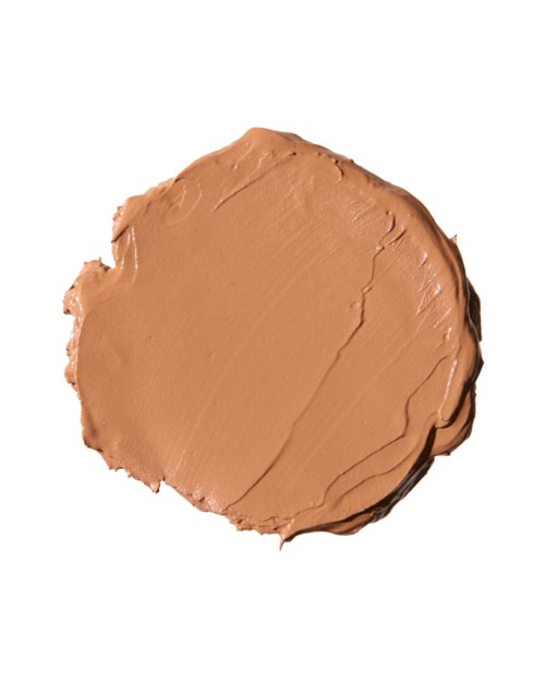 A round dollop of brownish-pink cosmetic cream with smooth texture on a white background.