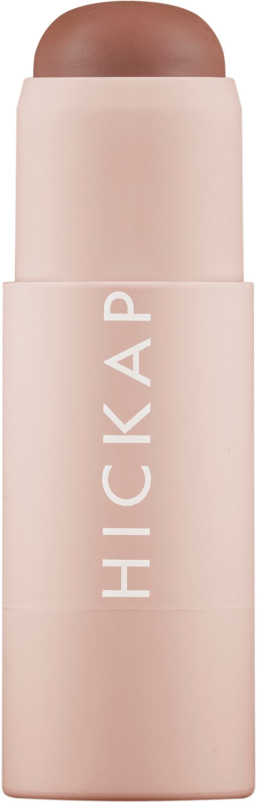 A pink stick with a rounded top, labeled 'HICKAP' on the side, looks like a lipstick or cream stick.