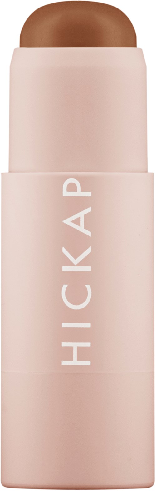 A pink stick with the words 'HICK API' on it, looks like a makeup or skincare product.