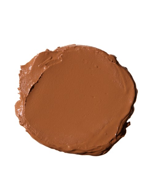 A round piece of chocolate spread or peanut butter on a white background.